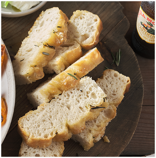 Slices of bread arranged on a surface.