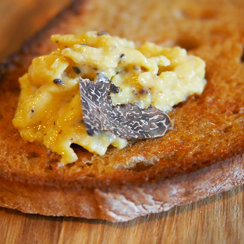 A bread topped with truffles.